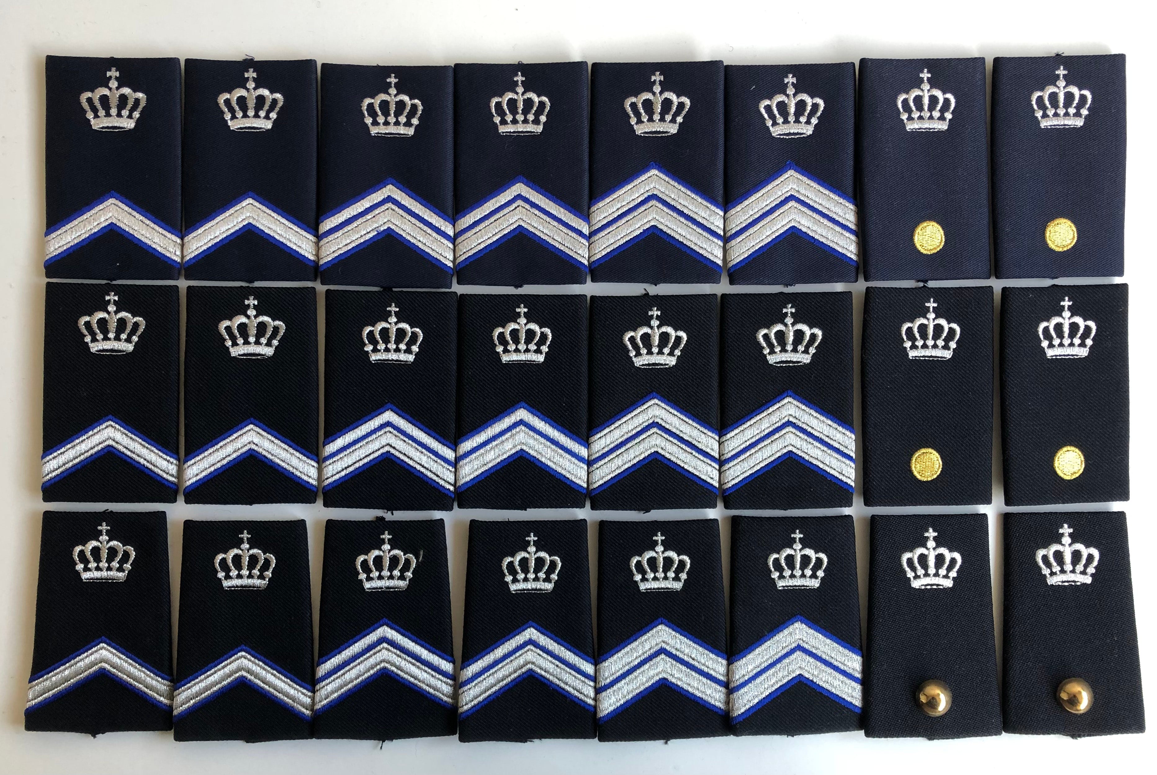Instructeursrangen voor blauwe pak, blouse en DT
